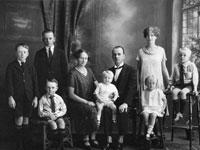 Notation by Lesley Madde
Left to Right: John Pearson, Bernard Pearson, Frank Pearson (sitting), Margaret Pearson (Faill), Walter Pearson, Charles Pearson, Mabel Pearson (standing), Myrtle Pearson (my mother) and Harold Pearson.
Bernard and Mabel were born in England before Margaret and Charles emigrated to Australia, the others in Newcastle, NSW, Australia.
My Uncle Walter was born in 1925 (he is the one sitting on his parents' knees) so I am guessing the photo was taken 1926/27. My cousin Terence has the same photo and my grandmother (Margaret) always sent photos for Christmas to Rellies in Hull. Uncle Wal was born 28th September 1925 so I think the photo was for Xmas 1927.
